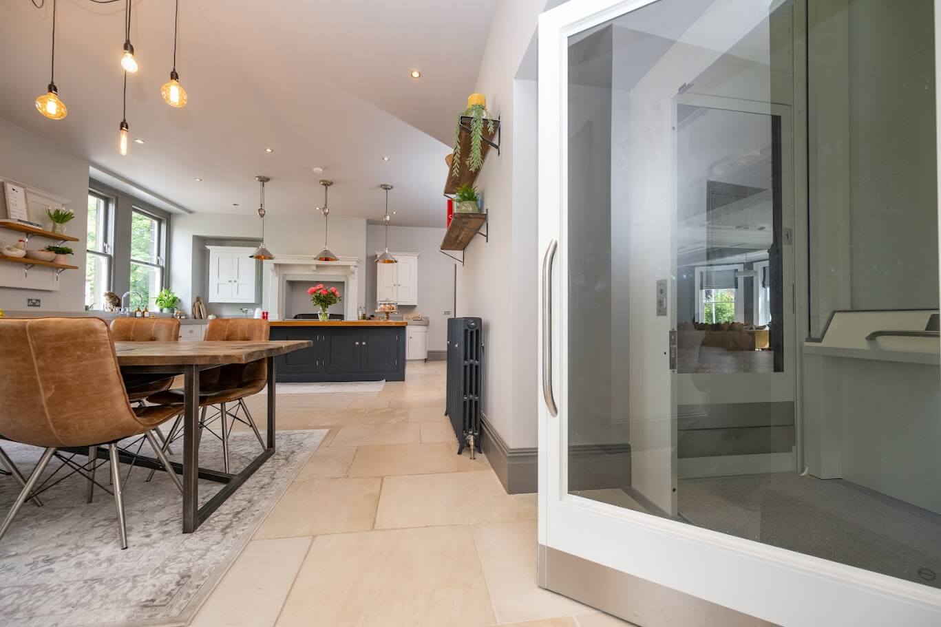 M8F-94 An image showing the purpose-built through-floor lift for a wheelchair user in the accessible home that Steven Dockers Associates designed.